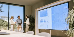 Business leaders reviewing strategic growth analytics on a digital display